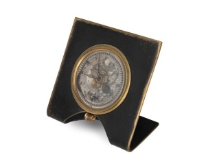 A vintage skeletonised automotive clock with crown wind, mounted in later housing, the clock 7.5cm high