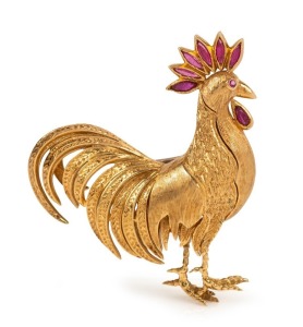 A vintage French 18ct yellow gold cockerel brooch adorned with eight rubies, 20th century, stamped "750", 5cm high, 18.8 grams