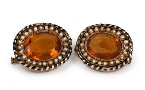 A pair of antique lapel brooches, set with cut citrines and seed pearls mounted in gold with black enamel banding, 19th century, most likely a tiara conversion, each 2.5cm wide