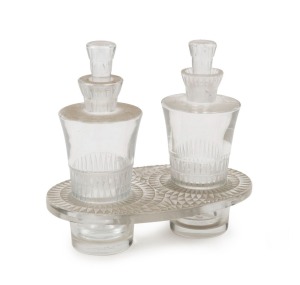 LALIQUE for WORTH French Art Deco two bottle perfume set in stand, circa 1930, stand acid etched "R. LALIQUE, FRANCE", the bottles 12.5cm high, the stand 3.5cm high, 15cm wide