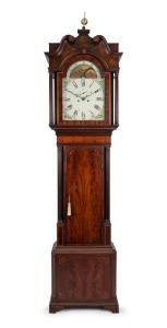 An antique English long case grandfather clock in mahogany case with fine stringing, cross-banding and satinwood bell inlay, full fluted columns to the hood and trunk and box style swan neck pediment, eight day time and bell striking movement with moonpha