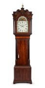 An antique English&nbsp;long case grandfather clock in mahogany case with fine stringing, cross-banding and satinwood bell inlay, full fluted columns to the hood and trunk and box style swan neck pediment, eight day time and bell striking movement with moonpha