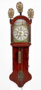 An antique Dutch Staart wall clock with alarm movement, hand-painted dial and Roman numerals, early 20th century, 147cm high