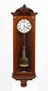 An antique Vienna regulator wall clock with time only single weight driven movement in walnut case, 19th century, 114cm high