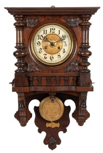An antique German wall clock in walnut case, with time and gong striking movement, late 19th century, 65cm high