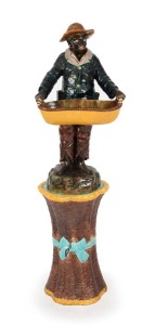 An antique Majolica Blackamoor statue on basket weave Majolica base, 19th century, 120cm high overall