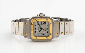 CARTIER "Tank" lady's automatic wristwatch in stainless steel case with gold highlights and sapphire crown, 2.5cm wide including crown
