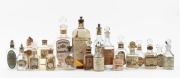 Twenty assorted antique French and English perfume and cosmetic bottles, all with original lithograph paper labels (some with contents), 19th and early 20th century, the largest 21cm high