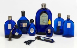Nine assorted vintage blue glass perfume and cologne bottles including two pocket examples, 20th century, the largest 14cm high