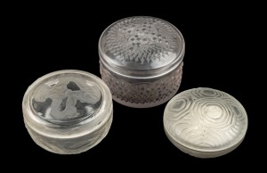 Three French glass lidded powder bowls, including LALIQUE, 20th century, the largest 9cm diameter