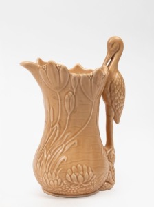 SYLVAC&nbsp;caramel glazed pottery jug with waterlilies and stork, mid 20th century, impressed factory mark to base, 26cm high