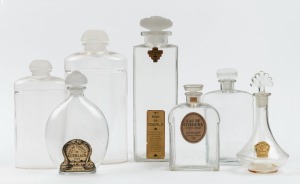 Seven assorted vintage and antique French glass perfume and cologne bottles including LALIQUE for COTY, the largest 26cm high