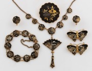 An attractive set of vintage Japanese jewellery comprising of a necklace, three brooches, a bracelet and pair of earrings, early to mid 20th century