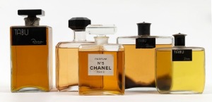 Five assorted point of sale advertising perfume dispensary bottles including CHANEL No.5 and TABU, the largest 22cm high
