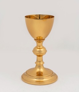 A gilt silver and brass offering chalice with engraved dedication to base "IN MEMORY OF 1st LT. FRANK A. D'AMICO", mid 20th century, 19cm high
