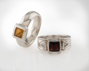 Two 19ct white gold rings, set with square stones, both stamped "825", 13.8 grams total