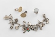A sterling silver charm bracelet, a silver and opal ring, and a pair of white gold cufflinks (8 grams), (3 items)