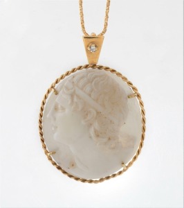 An antique 18ct yellow gold and diamond mounted shell cameo with carved profile portrait of a young classical man, suspended on an 18ct yellow gold chain by Donati & Spina of Arezzo, 19th and 20th century, the pendant 4cm high overall, the chain 2 grams, 7 grams total