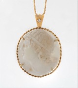 An antique 18ct yellow gold and diamond mounted shell cameo with carved profile portrait of a young classical man, suspended on an 18ct yellow gold chain by Donati & Spina of Arezzo, 19th and 20th century, the pendant 4cm high overall, the chain 2 grams, 
