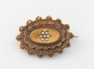 An antique English 15ct yellow gold oval brooch, set with a star cluster of seed pearls, made in Birmingham, circa 1889, 3.5cm wide, 5 grams