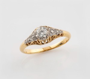 An antique 18ct yellow gold ring, set with a brilliant cut white diamond mounted in white gold, circa 1930, 2.4 grams