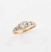 An antique 18ct yellow gold ring, set with a 0.2ct old cut white diamond in white gold mount, early 20th century, ​​​​​​​size J.5, 2.6 grams