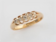 An antique 15ct yellow gold ring, set with five graduated old cut white diamonds, circa 1900, size L, 2.7 grams