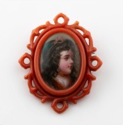 An unusual antique German faux coral mounted mourning brooch with hand-painted miniature portrait and woven hair window on the reverse, 19th century, 5.1cm high