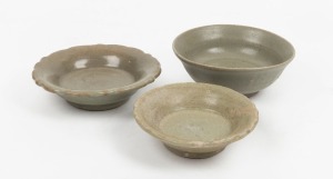Three assorted Chinese and Thai celadon dishes and bowls, 15th/16th century, the largest 4.5cm high, 12cm diameter