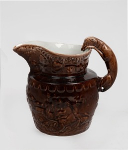An antique brown glazed pottery hunting scene jug with cream glazed interior, 19th/20th century, 20cm high