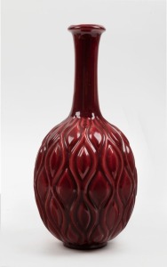 A Swedish burgundy pottery vase, mid 20th century, black factory mark to base "L. E., Made in Sweden", 28cm high