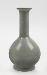 An antique Chinese celadon glazed bottle vase, 21cm high