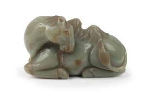 An antique Chinese carved jade dromedary, Qing Dynasty, 19th century or earlier, 12.high, 20.5cm long