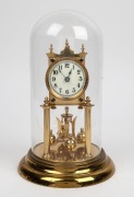 A German 400 day anniversary clock in glass dome, 20th century, ​​​​​​​31cm high