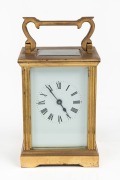 An antique French carriage clock with enamel dial and Roman numerals, 19th/20th century, 15cm high overall