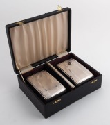 A boxed three piece sterling silver brush set&nbsp;in the Art Deco style, engraved with ownership monogram "W. L.", 20th century, the box 20cm wide