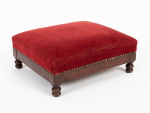 An antique French timber footstool with red velvet upholstery, 19th century, 16cm high, 39cm wide, 34cm deep