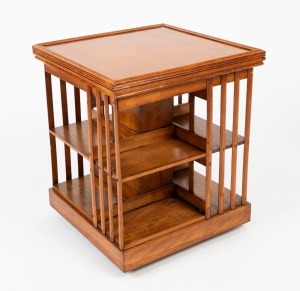 A maple revolving bookshelf with moulded perimeter top, two tiers, sixteen slats and plinth base, 54cm high, 45cm wide, 45cm deep