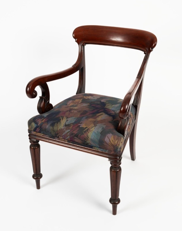 An antique English mahogany library armchair, circa 1825, 59cm across the arms