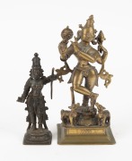 Two antique Indian cast bronze statues, comprising a standing Krishna, and a figure with staff, 18th/19th century, the larger 17cm high