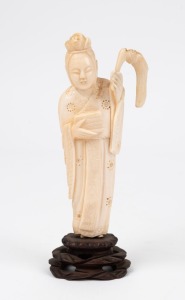 A Chinese carved ivory statue of a scholar with fly whisk on carved wooden stand, 19th/20th century, ​​​​​​​14cm high overall
