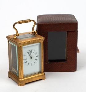 An antique miniature carriage clock in original leather case with key, 19th century, 10.5cm high including handle