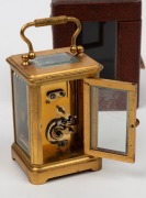 An antique miniature carriage clock in original leather case with key, 19th century, 10.5cm high including handle - 3
