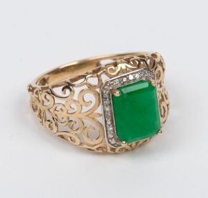A 9ct gold filigree work ring, set with an attractive natural emerald surrounded by brilliant cut diamonds mounted in white gold, 20th century, 3.2 grams total