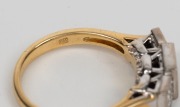 An 18ct yellow gold ring, set with twelve square cut diamonds mounted in white gold, 20th century, stamped "750" 6.9 grams total - 2