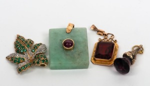 Four assorted gold mounted pendants, comprising of 14ct gold, jade and ruby, 14ct white and yellow gold with emeralds and diamonds and two 9ct gold examples set with coloured stones, 20th century, the jade example 3.5cm high