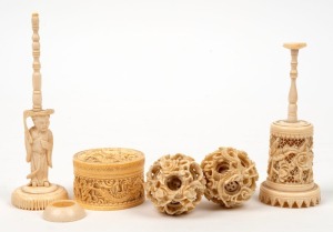 An antique Chinese carved ivory trinket box with dragon decoration, together with two carved ivory puzzle balls on stands (one incomplete), 19th/20th century, the largest 15.5cm high