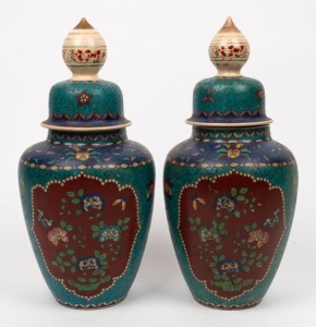An antique pair of Chinese cloisonne on porcelain lidded urns, 19th/20th century, ​​​​​​​34cm high
