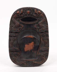 A Chinese inkstone decorated with two dragons, seal mark to base, 20th century, ​​​​​​​24cm high