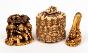 A Japanese carved ivory box with many faces, a carved figural group, and a carved ivory netsuke, Meiji period, 20th century, (3 items), ​​​​​​​the box 7.5cm high